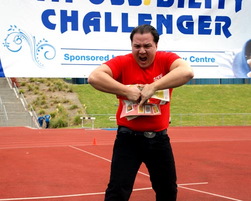 Albert Walter tears a phone book in two at the Impossibility-Challenger Games